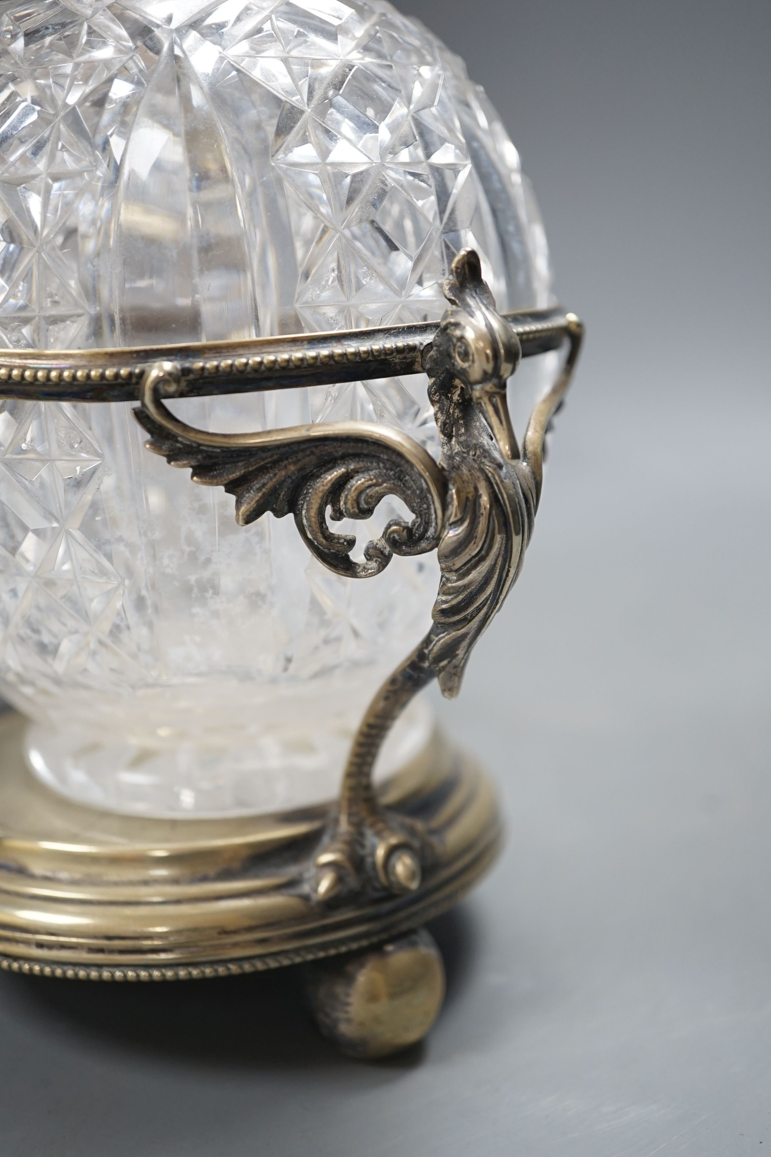A Victorian plated decanter stand and three cut glass decanters, 34 cms high.